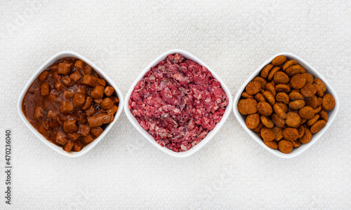 Selection of dogfood options, raw pets mince, chunks in gravy and dry kibbles
 photo