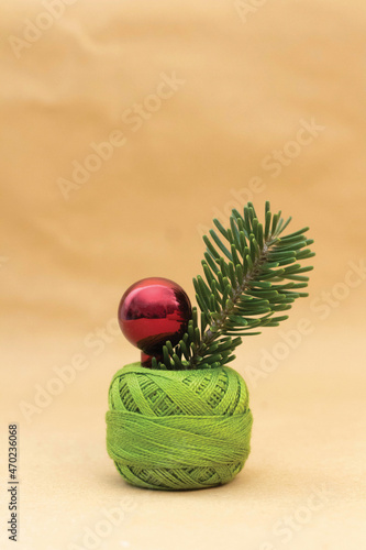Curly green embroidery thread with purple pearl and green herb inside
