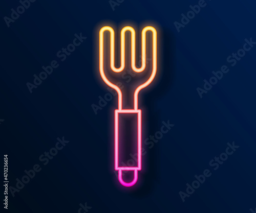 Glowing neon line Fork icon isolated on black background. Cutlery symbol. Vector