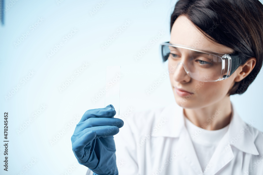 scientist sitting at the table microscope research biotechnology light background scientist sitting at the table microscope research biotechnology light background