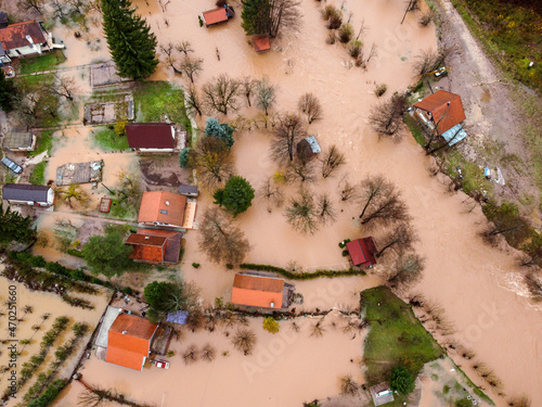 Aerial drone view of flooded villages, fields, farms and houses. Aftermath of devastating river flood and landslide. Catastrophic floods. Overflowing river, view from above.