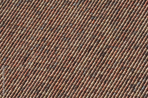 Tile roof background closeup view with sun and shadows