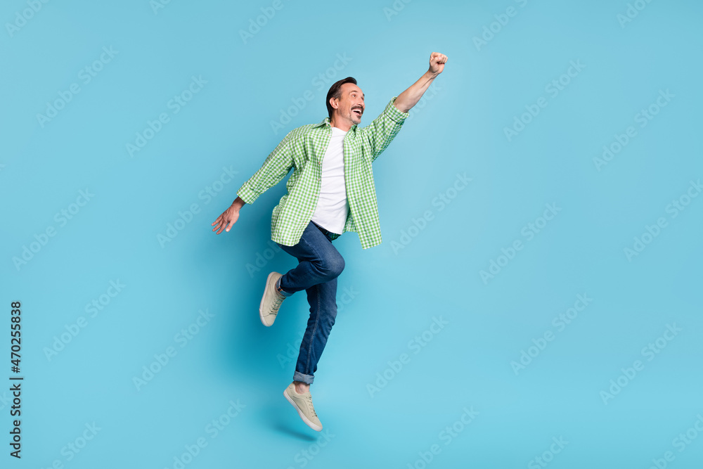 Full length body size view of attractive cheerful motivated man jumping struggling isolated over shine blue color background
