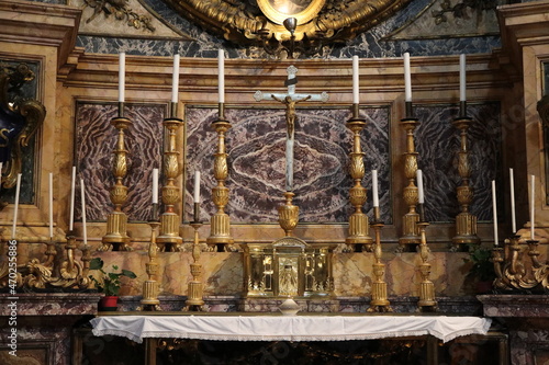 Altar Close Up with Cross and Golden Candlesticks at the Sant'Ignazio di Loyola in Campo Marzio Church in Rome, Italy photo