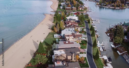 Aerial over houses and forest and lake in South Lake Tahoe, California