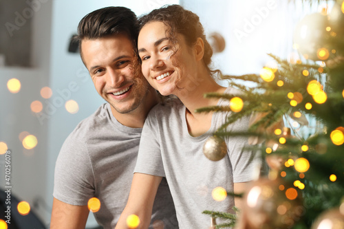 Happy young couple near Chr...