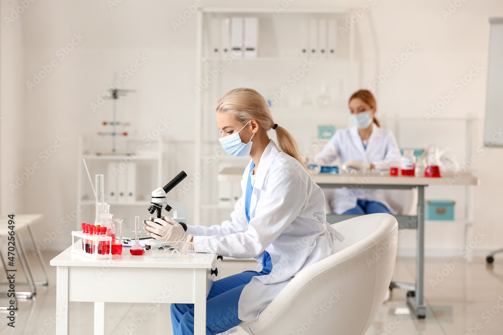 Scientist studying sample in laboratory Scientist studying sample in laboratory