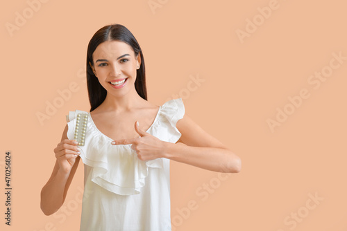 Beautiful woman with pills ...