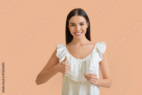 Beautiful woman with pills ...