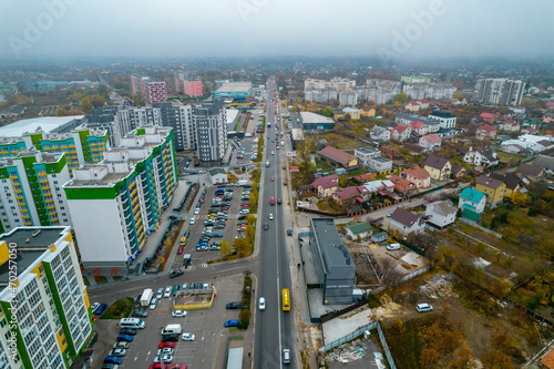 Aerial view of autumn city in fog