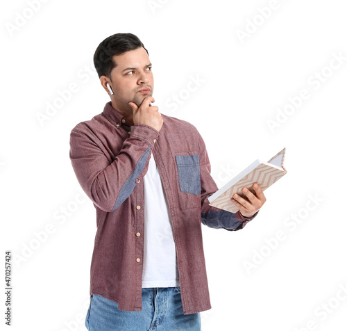 Thoughtful man with book an...