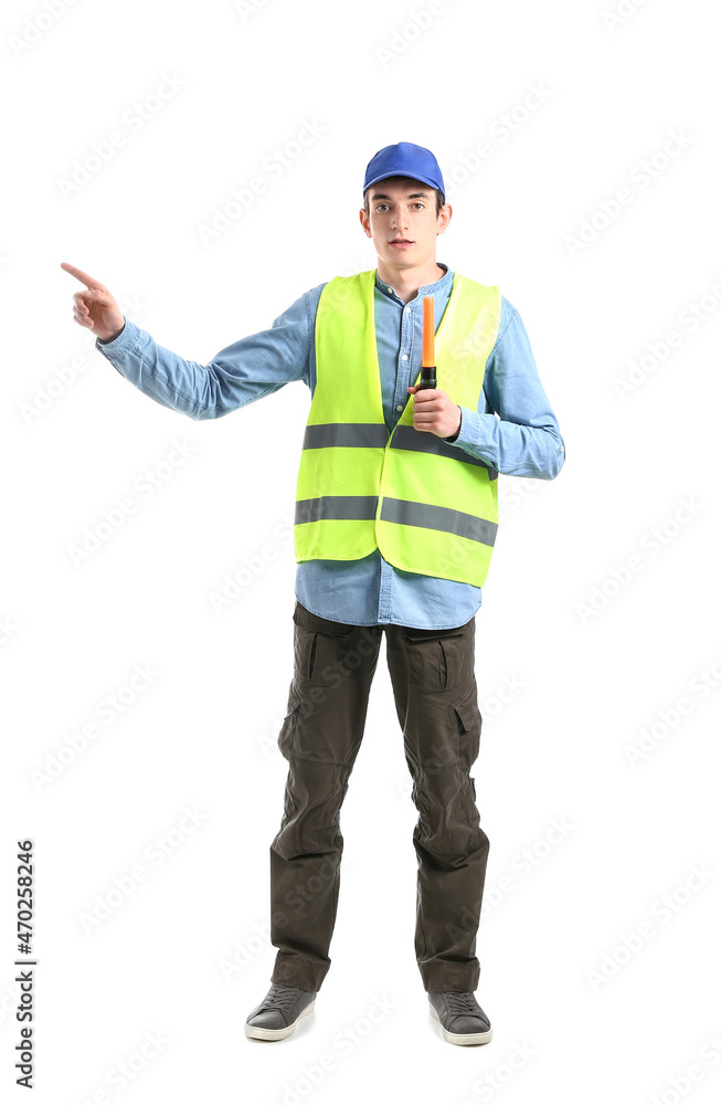 Young male worker with flashlight stick pointing at something on white background Young male worker with flashlight stick pointing at something on white background