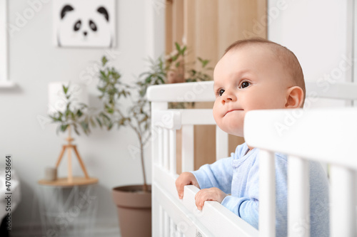 Cute little baby boy in crib