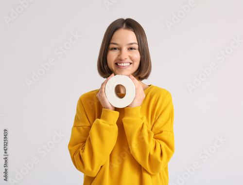 Young woman with toilet pap...
