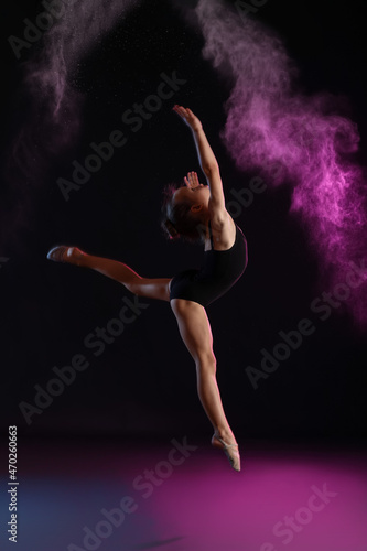 Little girl doing gymnastic...