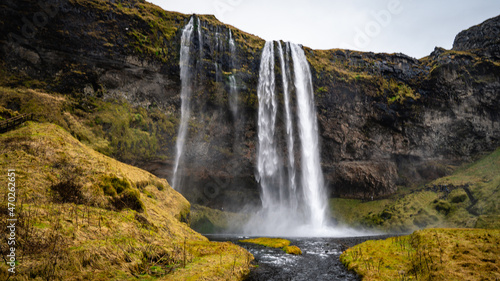 Panorama photo by Seljalandsfoss waterfall on Ring Road in beautiful nature landscape on Iceland. Beautiful waterfall in Southern Iceland