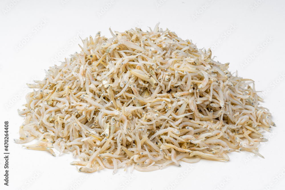 Fresh dried anchovies on White Background. Raw dry salted sea fish. saltwaterforage fish. Ikan asin teri medan. Fresh dried anchovies on White Background. Raw dry salted sea fish. saltwaterforage fish. Ikan asin teri medan.