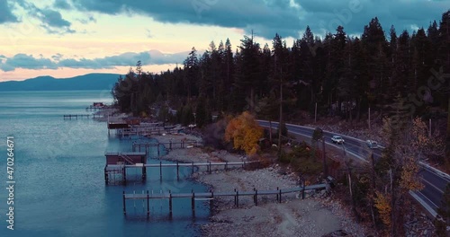 Aerial over shoreline and trees at Lake Tahoe