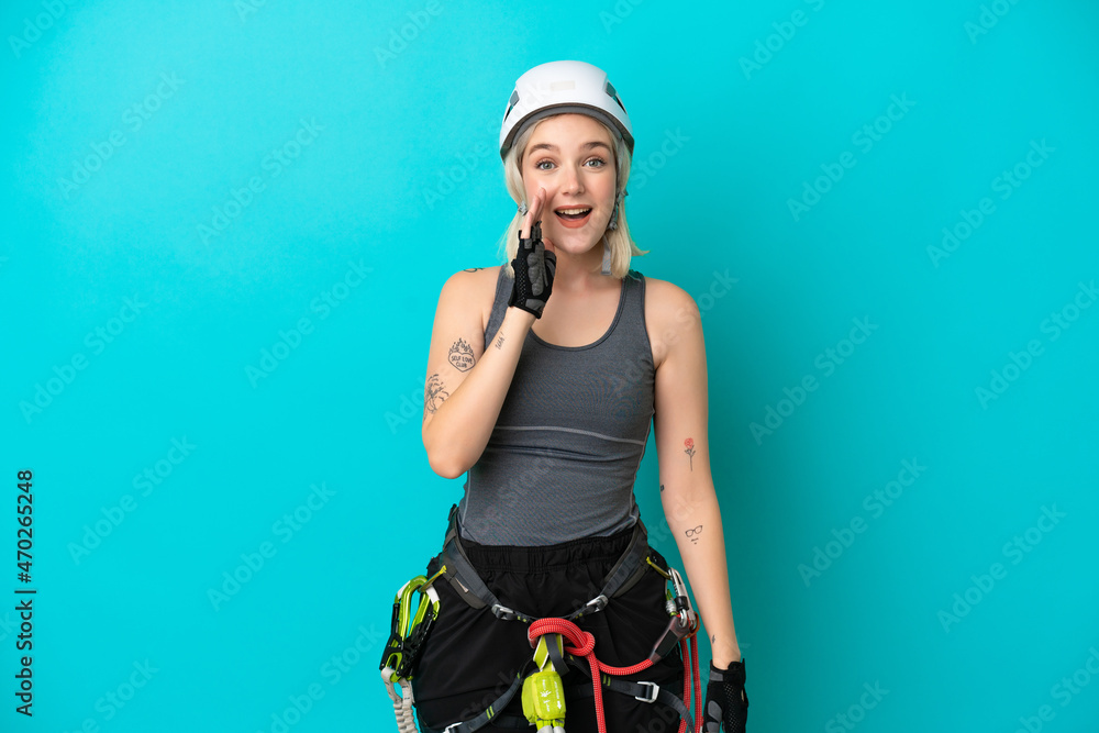Young caucasian rock-climber woman isolated on white background shouting with mouth wide open Young caucasian rock-climber woman isolated on white background shouting with mouth wide open