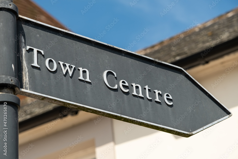 Obraz premium Old vintage town centre arrow shaped sign, pointing the direction