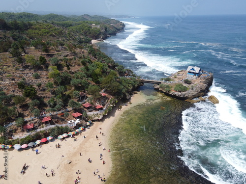 the panoramic beauty of the tourist attraction of Baron Kukup Sepanjang Beach, Gunung Kidul Regency, Yogyakarta Special Region photo