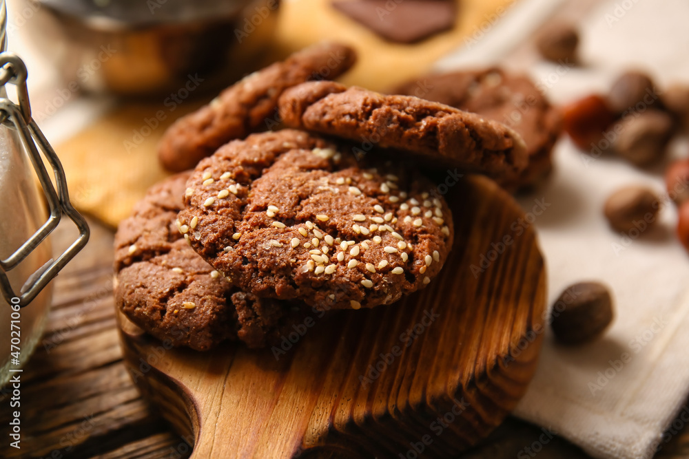Board with tasty chocolate homemade cookies on table, closeup Board with tasty chocolate homemade cookies on table, closeup
