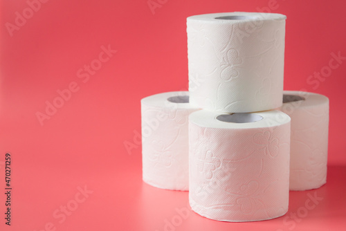 Toilet paper on pink background