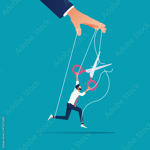 businessman use scissors to cut controlled strings puppet, giving it freedom, freedom for work or escaping a controlling concept