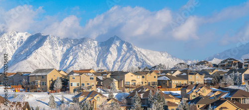 Residential area at Draper in Utah with snow against the Mount Timpanogos of Wasatch mountains