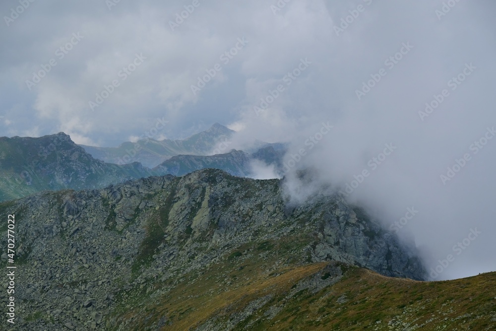 Beautiful mountain view above clouds from peak Djeravica (Gjerovica) - the highest peak of Kosovo. Albanian Alps, Peaks of Balkans