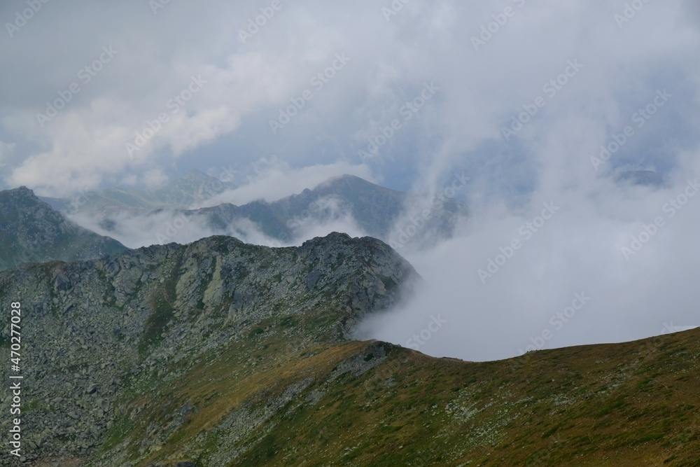 Beautiful mountain view above clouds from peak Djeravica (Gjerovica) - the highest peak of Kosovo. Albanian Alps, Peaks of Balkans