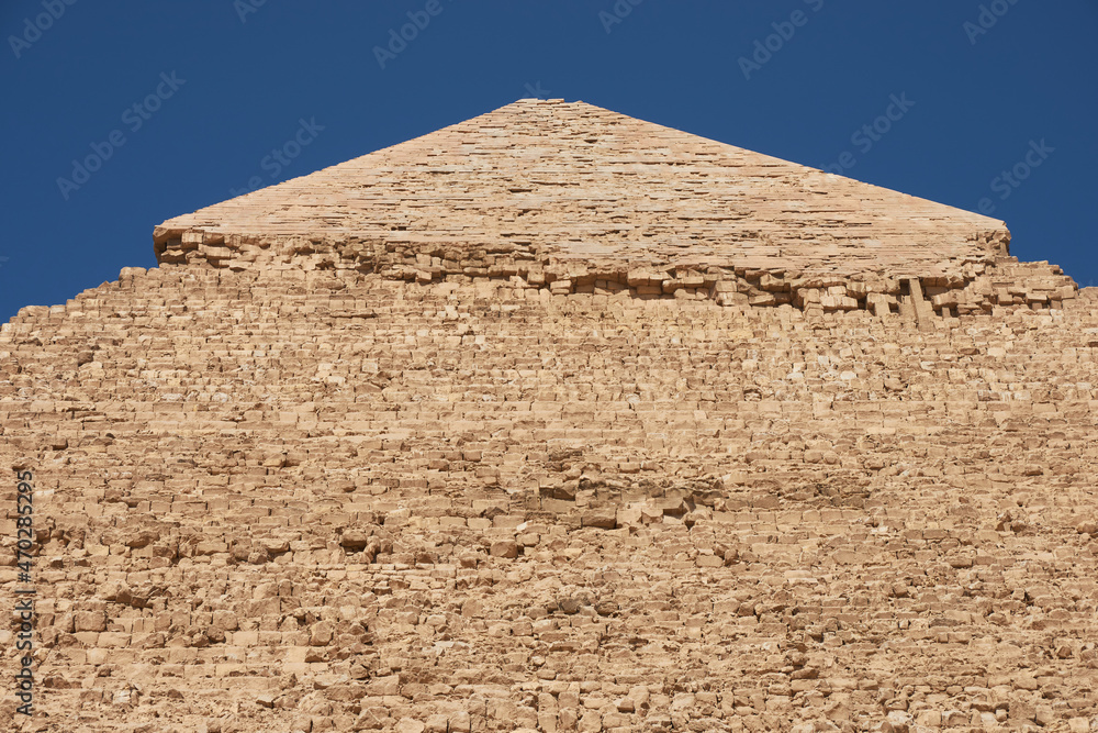 Side and faced top of  Pyramid of Khafre (also read as Khafra, Khefren) or of Chephren is the second-tallest and second-largest of the Ancient Egyptian Pyramids of Giza