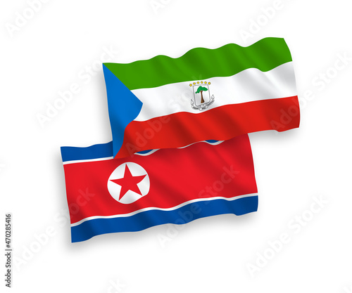 National vector fabric wave flags of North Korea and Republic of Equatorial Guinea isolated on white background. 1 to 2 proportion.