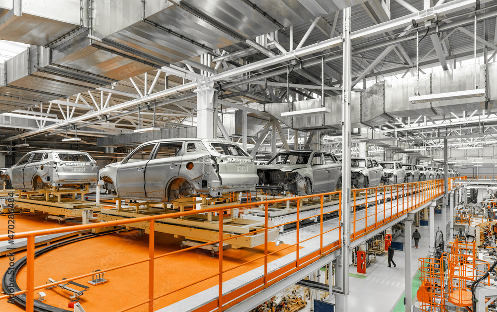 Automobile production line. Welding car body. Modern car assembly plant