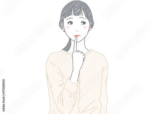 顎に指を当てて考え事をしている女性