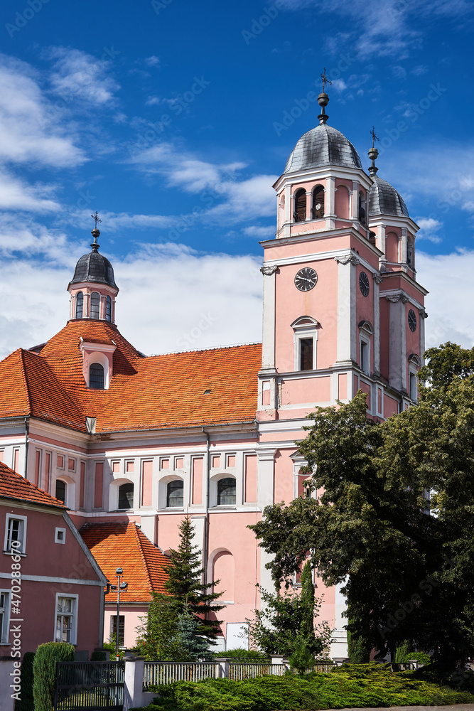 Bell towers of a baroque Catholic church in the city of Sierakow