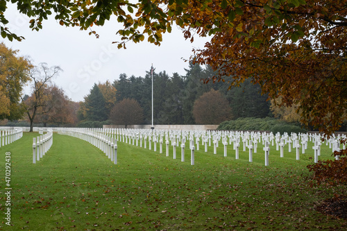 Plombieres, Belgium - November 1, 2021: Henri-Chapelle American Cemetery and Memorial. Many of the burial are from  Ardennes winter offensive (Battle of the Bulge). Autumn rainy day. Selective focus. photo