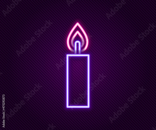 Glowing neon line Burning candle icon isolated on black background. Cylindrical candle stick with burning flame. Colorful outline concept. Vector