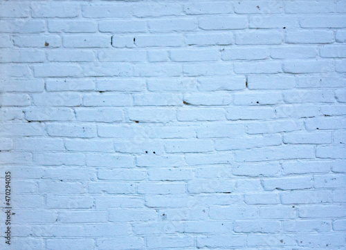 An old, uneven, brick wall. The brick texture is blue.