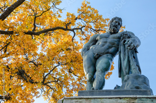 St. Petersburg, Russia - october 2021: Statue of Hercules and autumn foliage (golden autumn) in Catherine Park, Pushkin (Tsarskoye Selo)