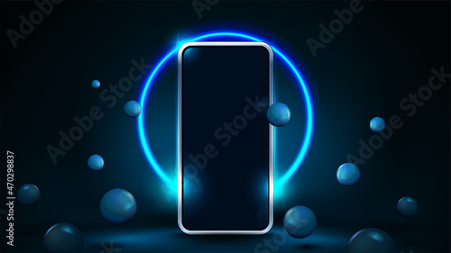 Smartphone mock up in blue scene with realistic bouncing spheres and neon ring on background.