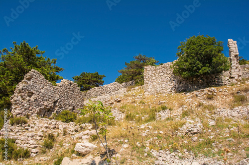 The ruins of the medieval Baska Citadel  Kastel Baska  overlooking the south Krk island town of Baska in the Primorje-Gorski Kotar County of western Croatia 