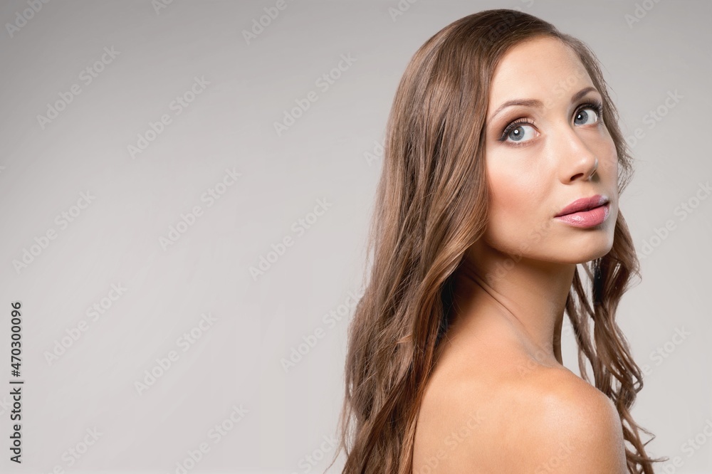 An young female model posing on the background An young female model posing on the background