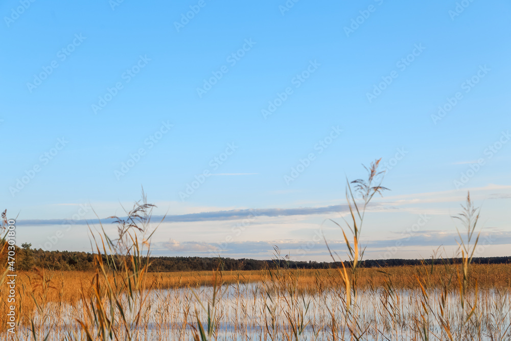 Sunset sky over a lake on an autumn day Sunset sky over a lake on an autumn day