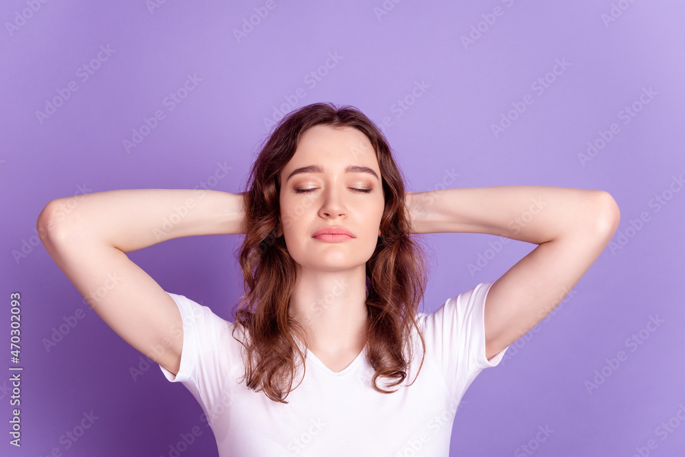 Top above high angle view photo of young girl hands behind head rest relax comfort sleep isolated over purple color background Top above high angle view photo of young girl hands behind head rest relax comfort sleep isolated over purple color background