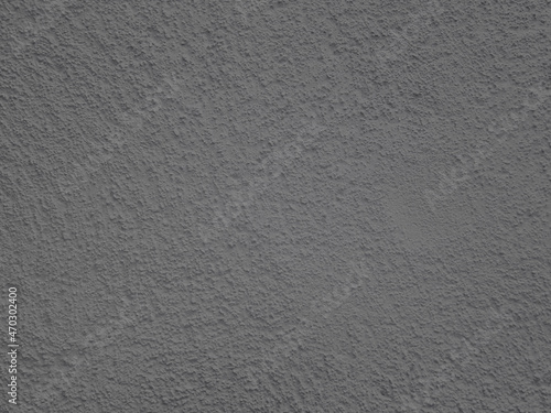 abstract dark gray plaster wall grunge natural retro texture with cement natural brick wall pattern on dark gray.