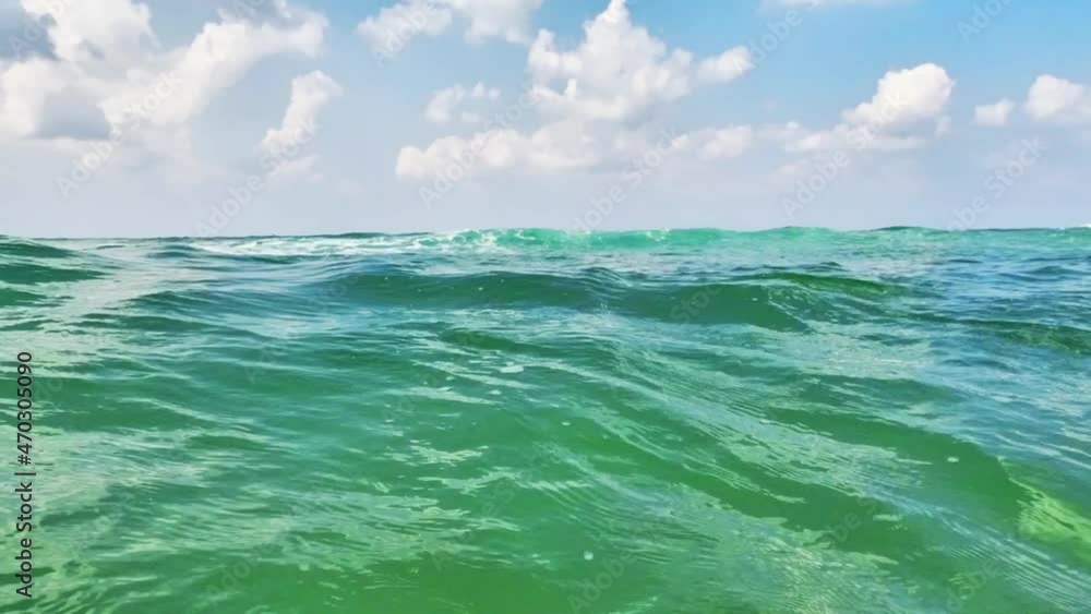 Azure sea with waves against a blue sky with white clouds. High quality FullHD footage Azure sea with waves against a blue sky with white clouds. High quality FullHD footage