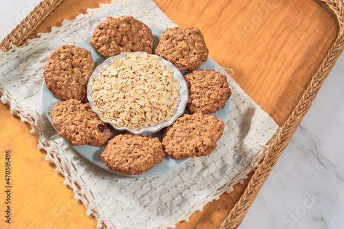 Homemade oatmeal cookies and oat flakes. Healthy dessert concept.