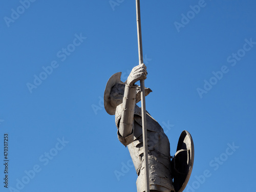 Statue of Don Quixote of La Mancha with the armor, the spear and the shield in Puerto Lapice, province of Ciudad Real, Castila La Mancha, Spain. Photography with copy space photo
