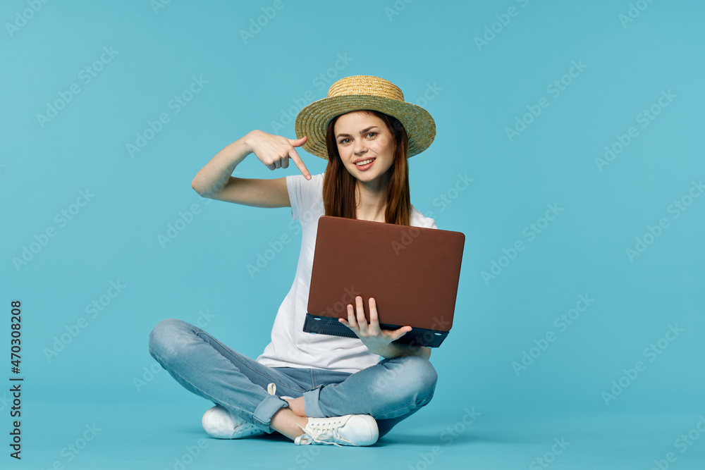 woman with laptop learning internet online education blue background